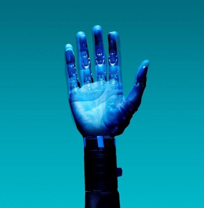 prosthetic arm on blue background